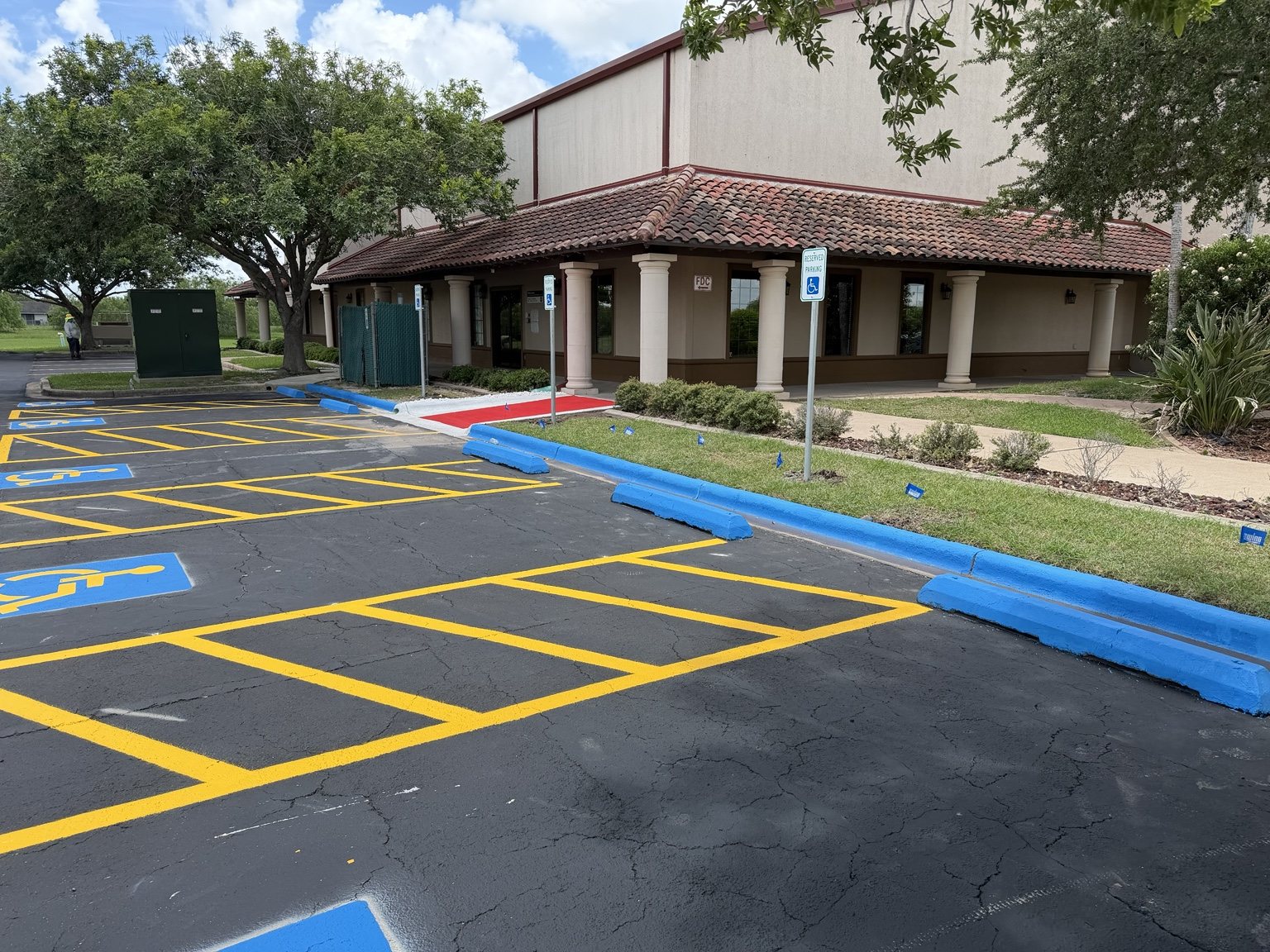 Accessible parking and yellow access aisle striping