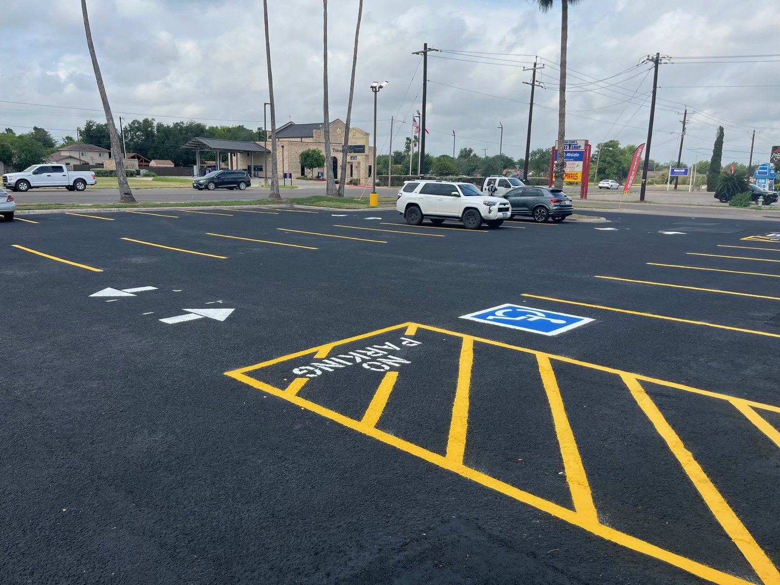 Fresh yellow parking lines and directional markings