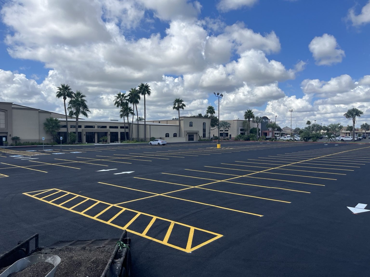 Large commercial parking lot with yellow striping